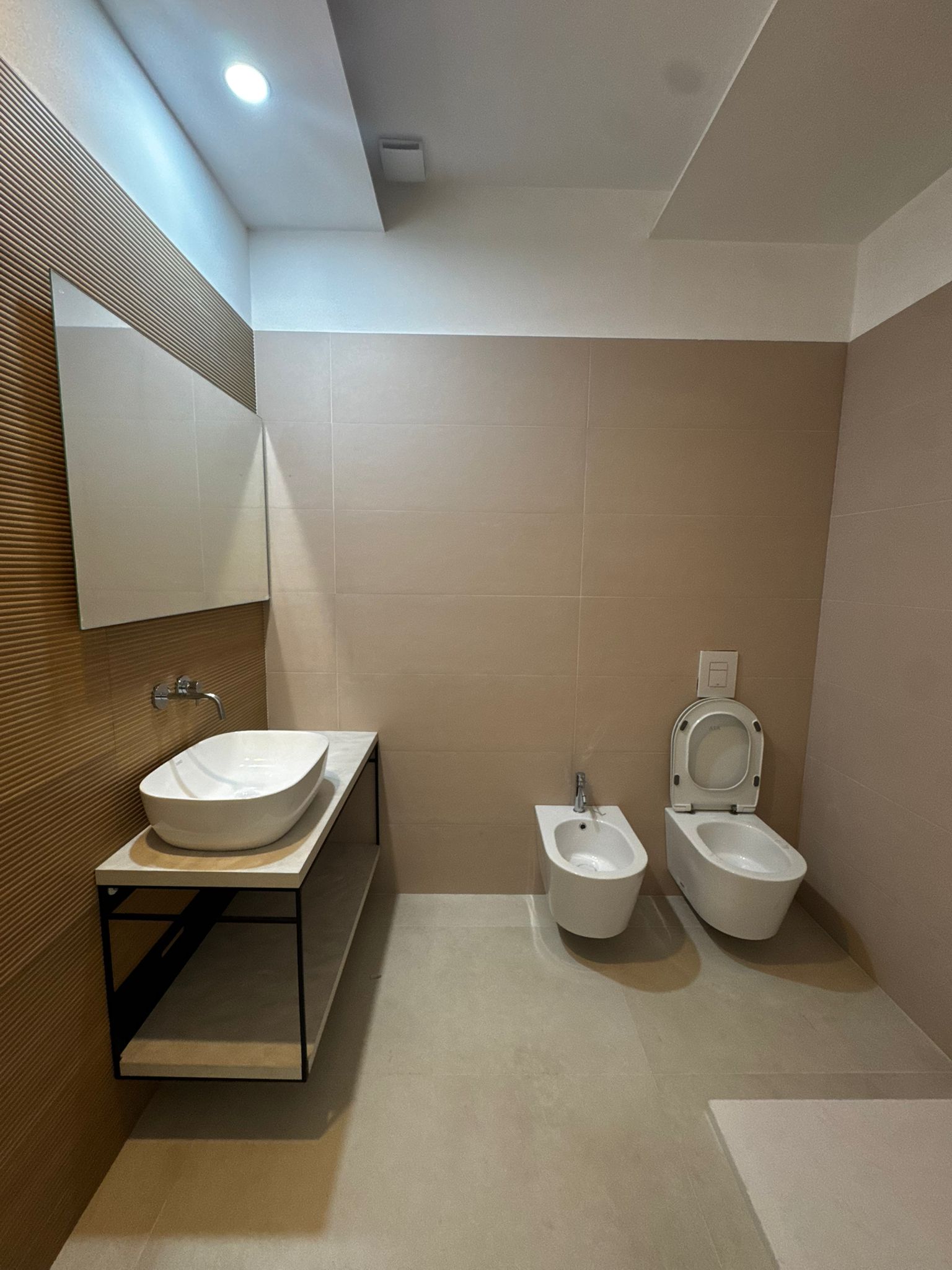Modern private bathroom with sink and sanitary fixtures